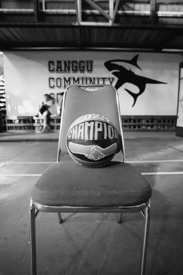 A 2024 Champion basketball resting on a chair at Canggu Community School